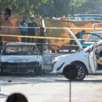 Rescue workers and police at the site of the Islamabad suicide blast outside the district court.