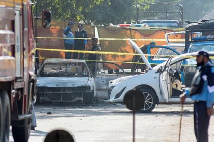 Rescue workers and police at the site of the Islamabad suicide blast outside the district court.