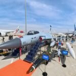 “Pakistan JF-17 Thunder Block III fighter jet displayed at Dubai Airshow 2025 with full weapons loadout, attracting visitors, while Tejas faces backlash over oil leak incident.”