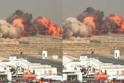 A HAL Tejas fighter jet moments before its crash during an aerobatic display at the Dubai Airshow 2025, with smoke visible as the aircraft loses stability.