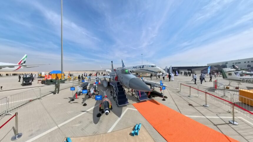 "Pakistani JF-17 Thunder fighter jet and Karakoram-8 training aircraft displayed alongside Pakistan and Sudan flags, symbolizing the historic $1.5 billion defense cooperation agreement that establishes Pakistan as a leading global defense exporter"